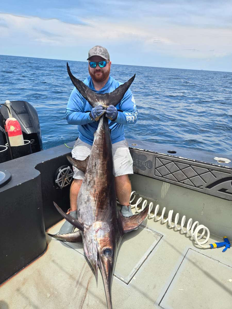Captain Josh Gray with a trophy swordfish